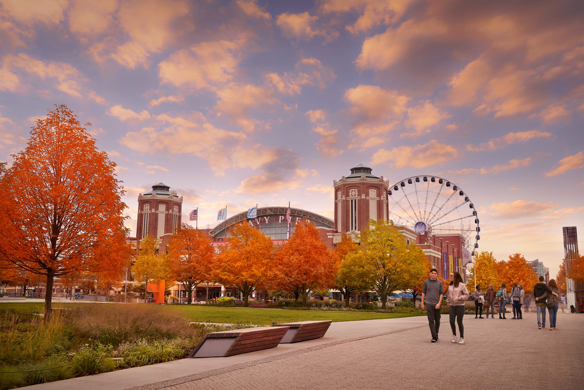 view of navy pier in the fall with the ferris wheel in the back