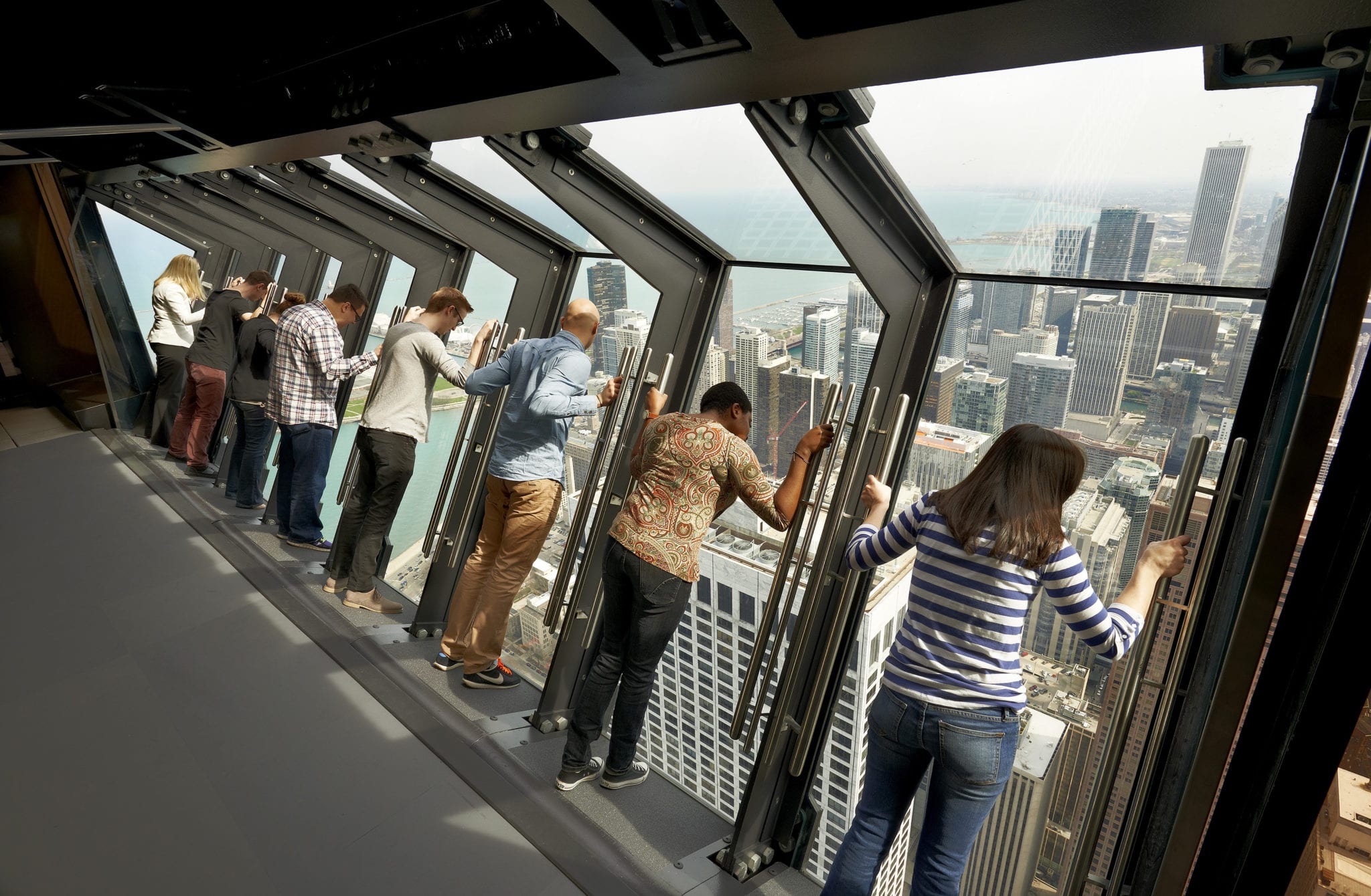 people on the Tilt, an attraction at 360 Chicago