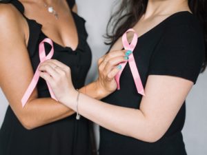 two ladies breast cancer awareness month pink ribbon