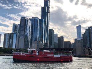 Chicago Fireboat Tours in front of the Chicago skyline.