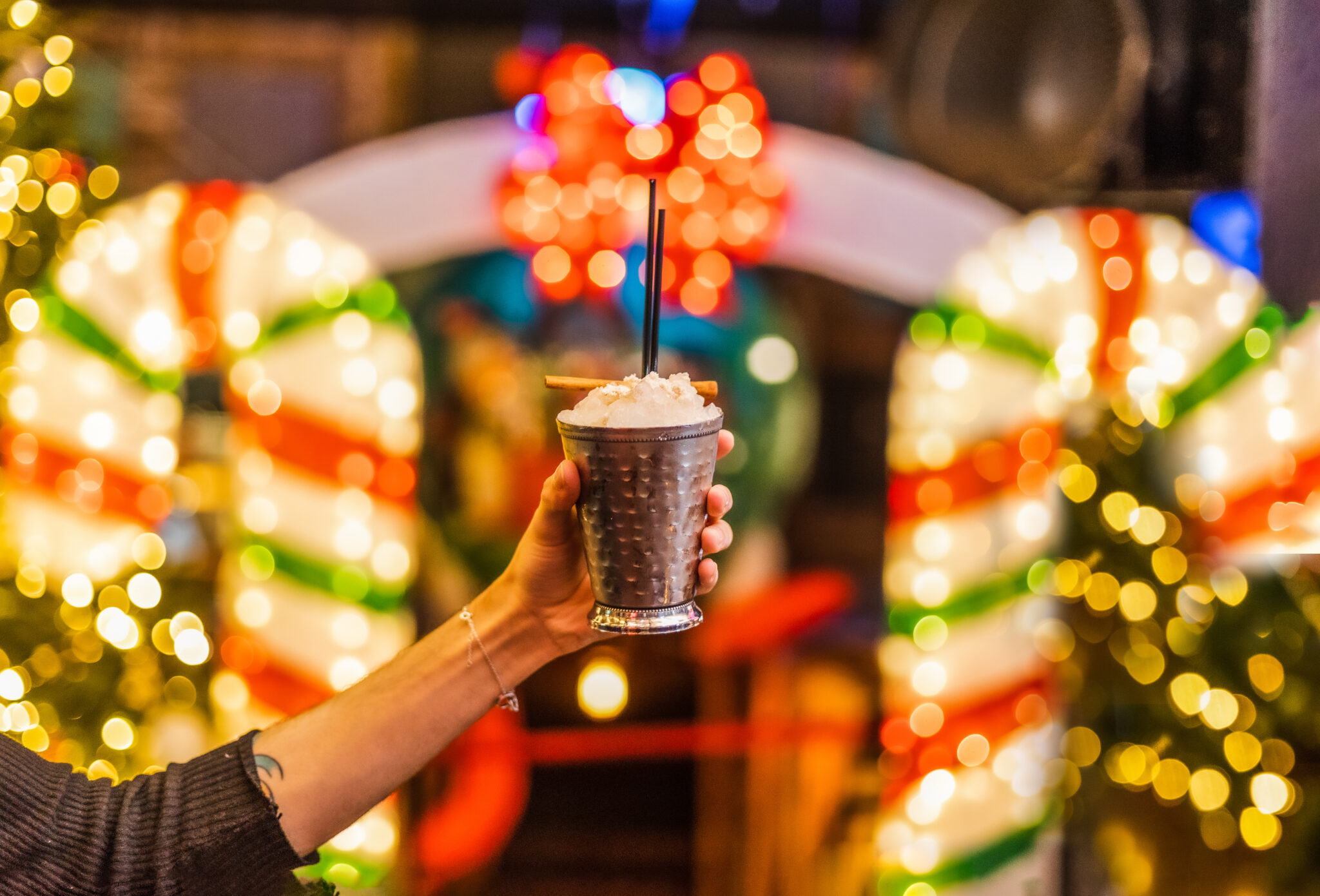 festive drink with holiday lights in the background