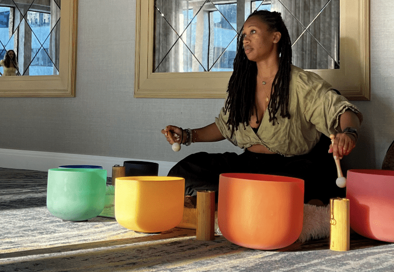 Lady leading a sound meditation session